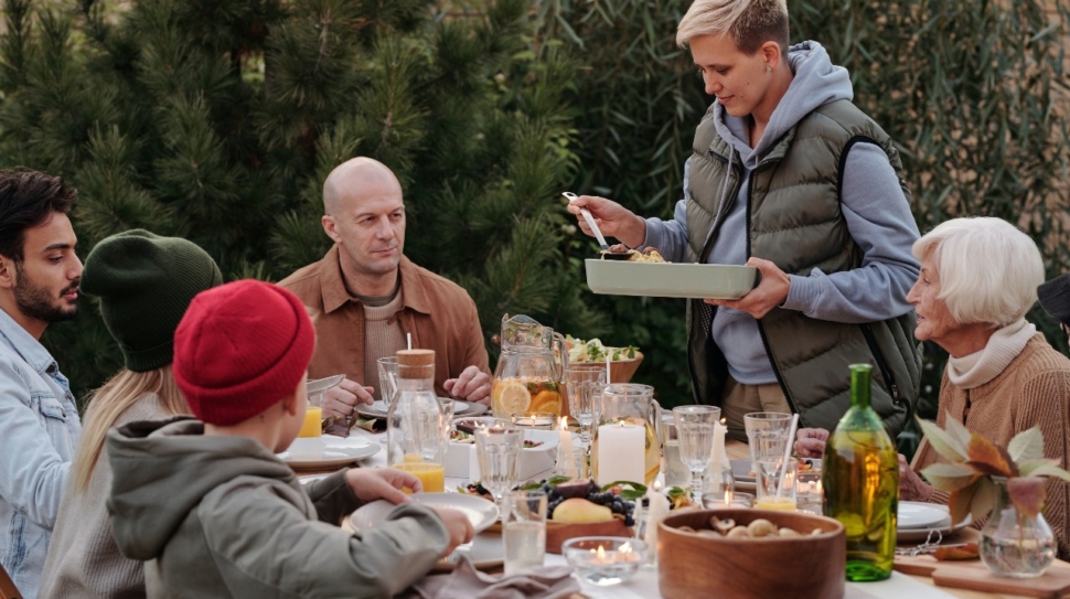 A family shares an outdoor meal.
