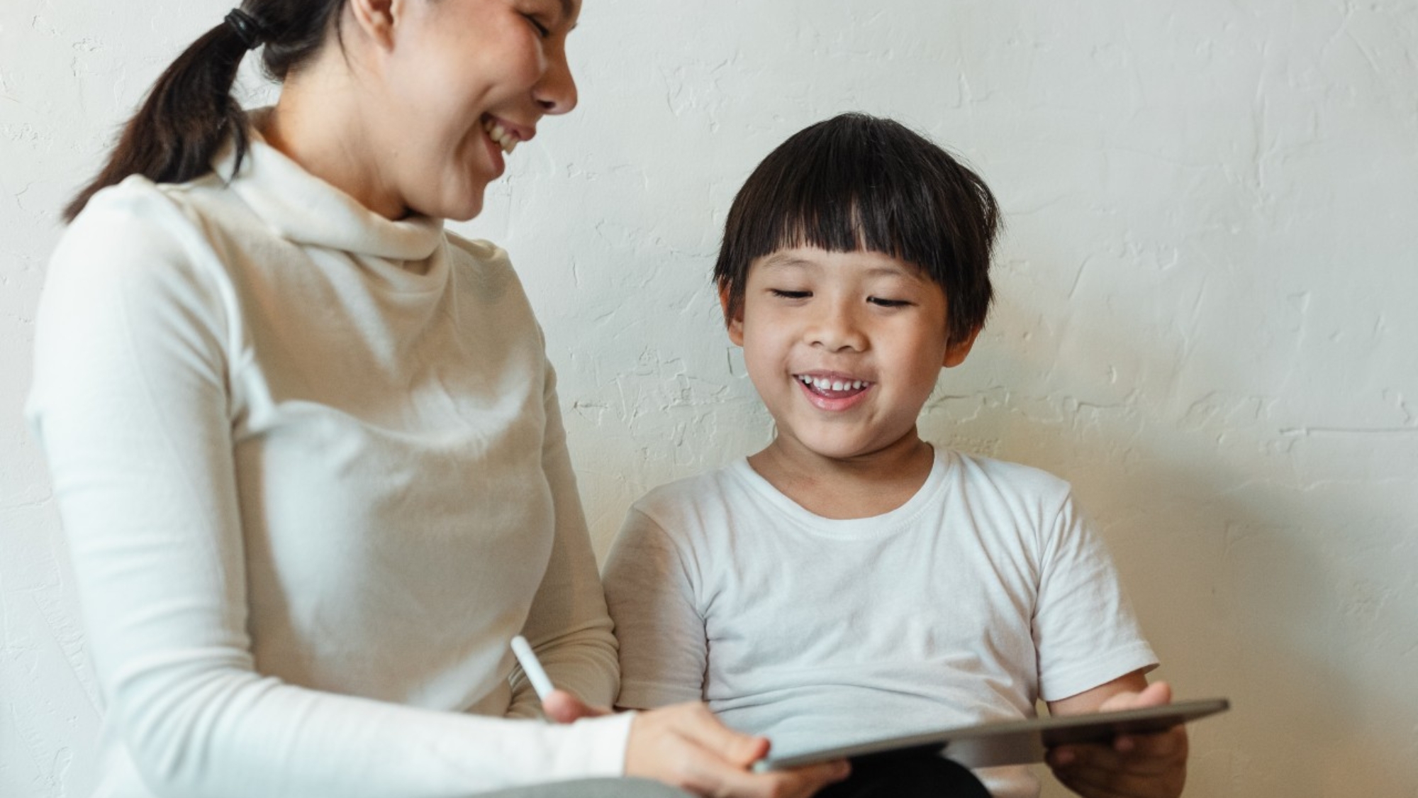 A child laughing at a new discovery
